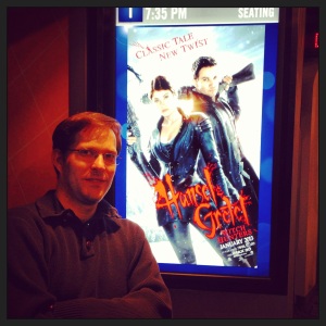 Hubby posing with the movie poster
